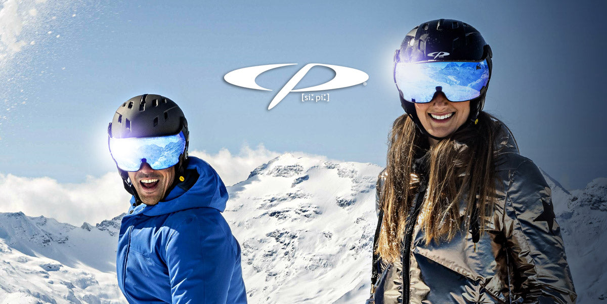 Man and woman wearing a CP Visor ski helmet on the slopes