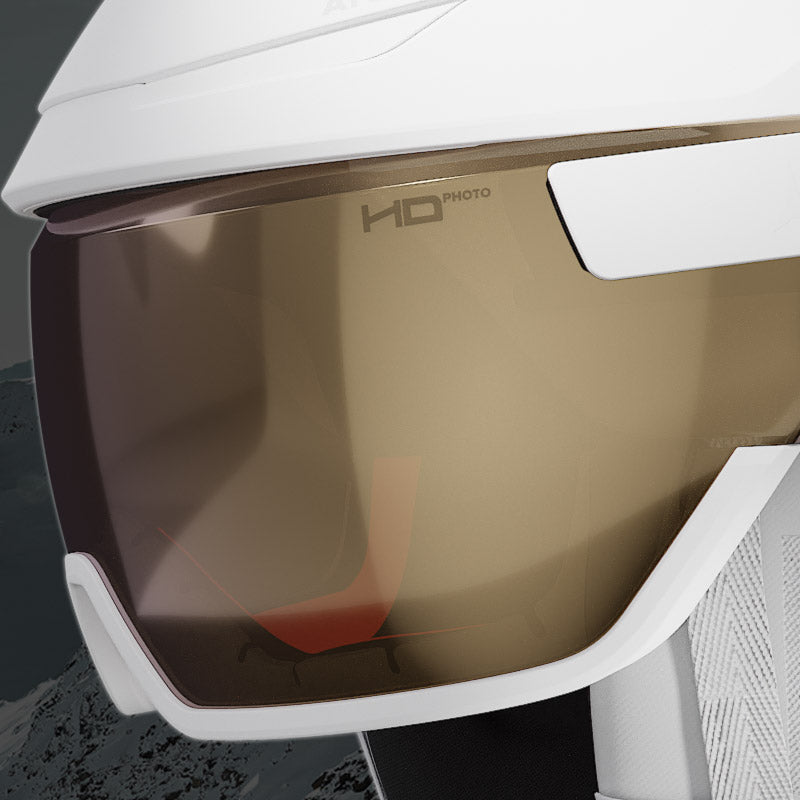 Close-up of a white ski helmet with a brown visor, featuring the 'HD Photo' logo.