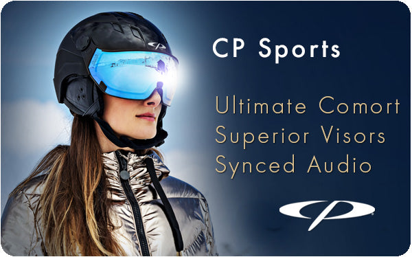 Woman wearing a CP Sports visor ski helmet with built in audio system