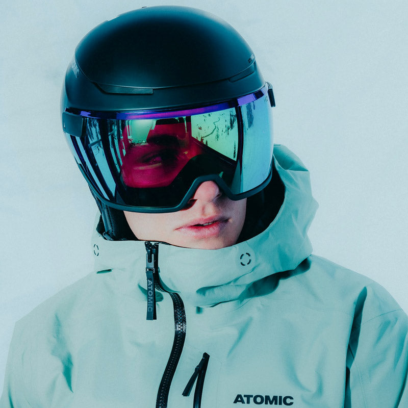 Man wearing Atomic Revent ski helmet with visor