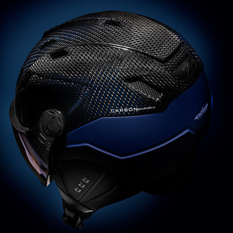 Black and blue helmet with 'Carbon' text on a dark background
