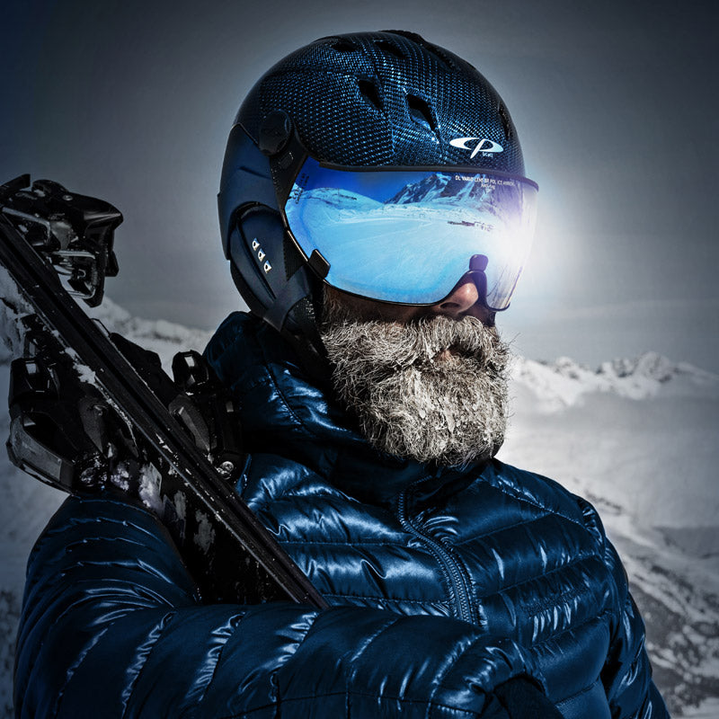 Man wearing black carbon visor ski helmet