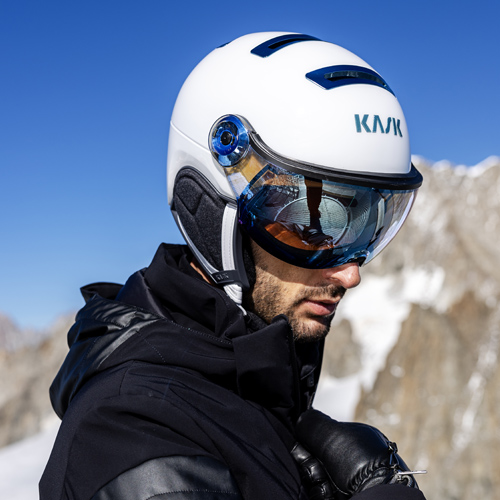 Man wearing white Kask visor ski helmet