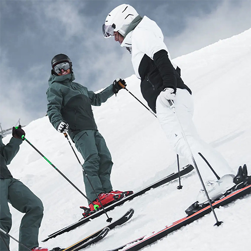 Man wearing white Atomic visor ski helmet